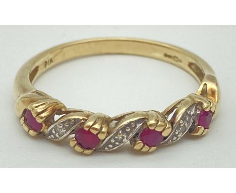 A 9ct gold, ruby and diamond twist design half eternity ring. 4 small round cut rubies interspaced with illusion set diamond 