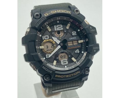 A G-Shock Mudmaster GWG 100 Multi Band 6 Tough Solar wristwatch with green plastic strap and black metal case. Multi function