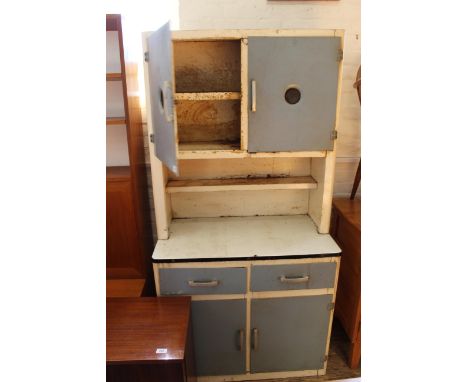 A vintage pressed steel blue and white kitchen unit, with two cupboard above preparation area and two drawers and two cupboar