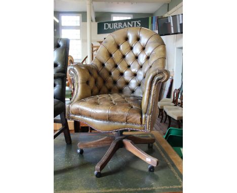 A Victorian style green leather button back high back office chair