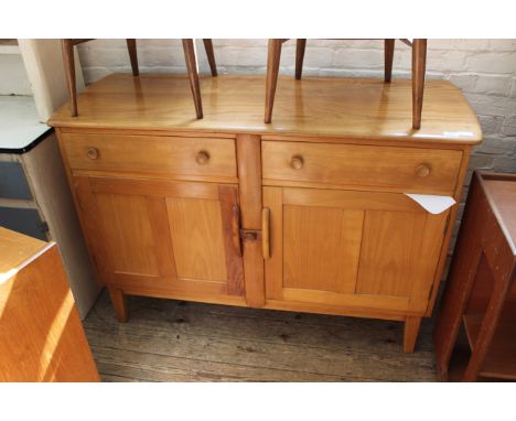 An Ercol light oak sideboard with two drawer and cupboards