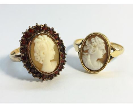 Two carved shell cameo rings. The first set with garnets in 9ct gold, size P and a half, total weight 4.64 grams. The second 
