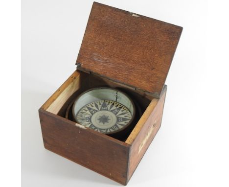 An early 20th century ship's compass, in a wooden case, 21cm