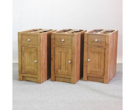 Three light oak kitchen base units, each 45cm