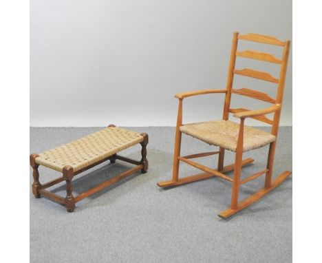An early 20th century light oak rocking chair, together with a similar footstool