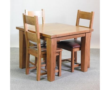 A light oak dining table, 100cm square, together with three dining chairs