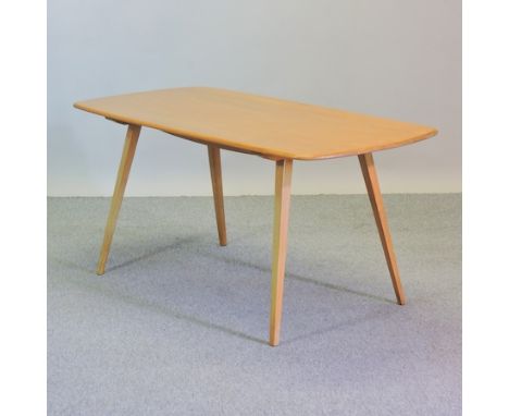 A 1970's Ercol light elm dining table, on a splayed base, 151 x 76cm