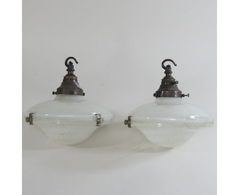 A pair of mid 20th century holophane style glass light shades, each 23cm diameter