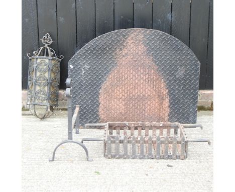 An iron fire back, 97cm, together with a fire basket and a wrought iron lantern