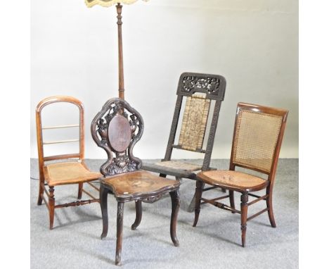 A 19th century Swiss inlaid side chair, together with three various 19th century chairs and a turned wooden standard lamp and