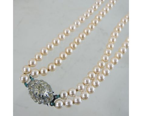 A two strand simulated pearl necklace, by Lotus, boxed