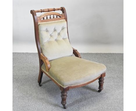 A Victorian mahogany green upholstered button back library chair