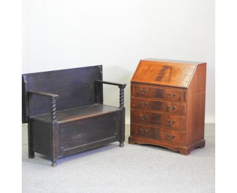 A reproduction mahogany bureau, 76cm, together with a monk's bench