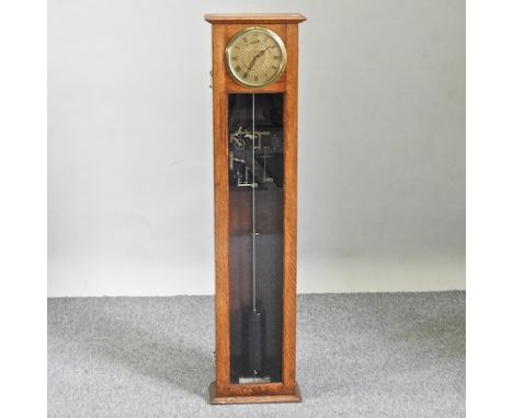 An early 20th century light oak cased synchronome electric wall clock, with a glazed case, 128cm high