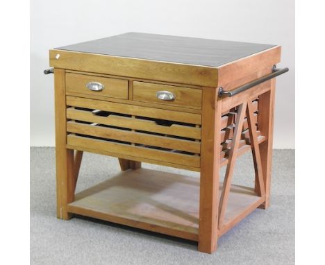 A light oak kitchen island, with a black granite top, 103cm