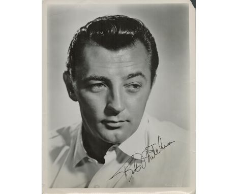 Robert Mitchum signed 10x8 black and white vintage photo. Good condition. All autographs are genuine hand signed and come wit
