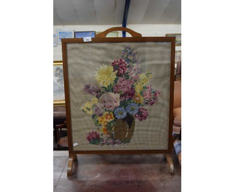 A needlework firescreen