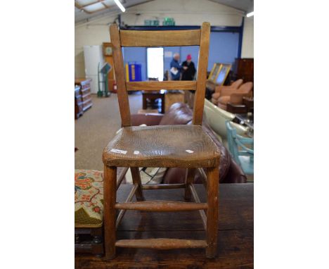 A Victorian elm seated child's chair together with tapestry covered footstool