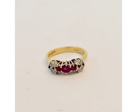 An 18ct gold ruby and diamond set engagement ring. Weight 4.3grams