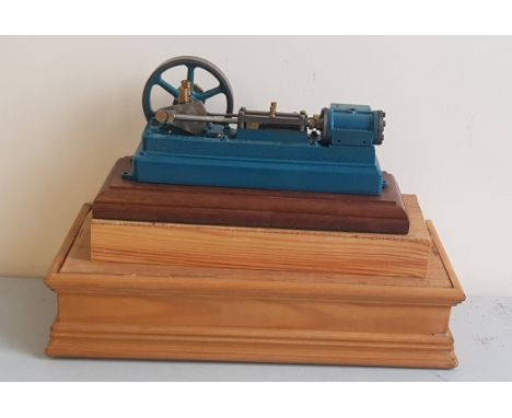 A Stuart model live steam engine in case.