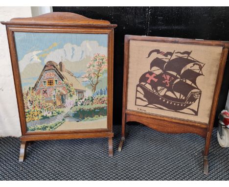 Two oak fire screens with tapestry panels.