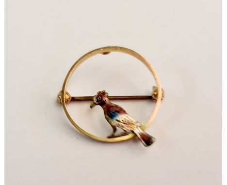 An enamel bird brooch, stamped 9ct.