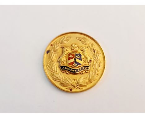 A hallmarked 9ct yellow gold enamel medallion