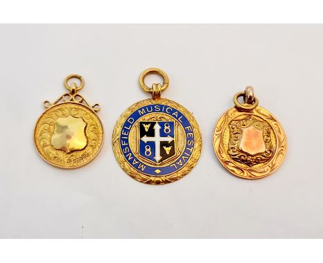 Two 9ct gold pendants with shield motif to front together with a 9ct gold and enamel pendant Mansfield Musical Festival. Tota