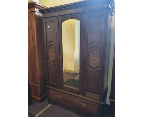 An Edwardian single mirror-door wardrobe.
