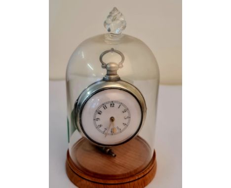 A London hallmarked silver pair cased pocket watch with white enamel face and verge movement in glass domed case.