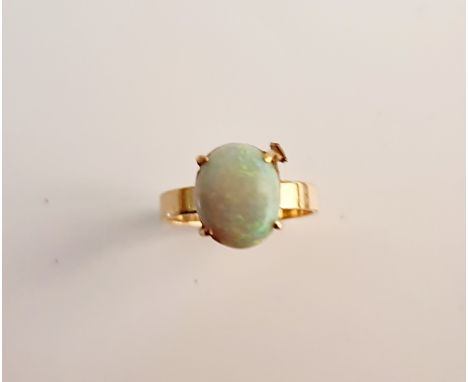 An opal cabochon ring, stamped 10ct, ring size M½.