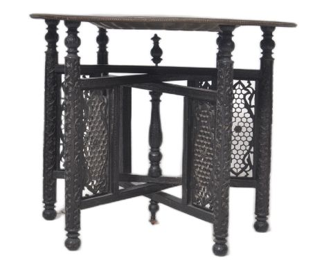 A 19th Century Anglo Colonial Indian Persian Islamic brass benares table. Comprising a heavy brass top with detailed lacquere