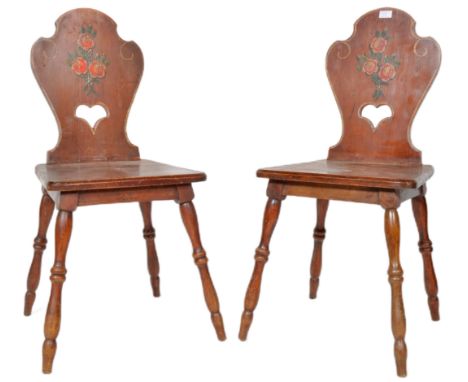 A matching pair of 19th Century Victorian mahogany side chairs having one panel carved backrest with hand painted floral deco
