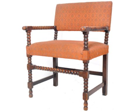 A late 19th Century Arts &amp; Crafts William &amp; Mary revival armchair. The chair with bobbin turned arms, legs and suppor