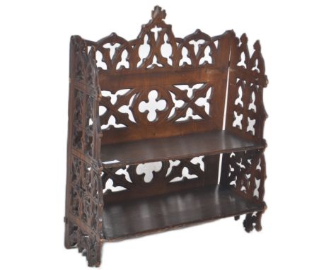 A 19th Century Gothic Ecclesiastical set of wall hanging bookcase display shelves / spice rack having carved fret pieced gall