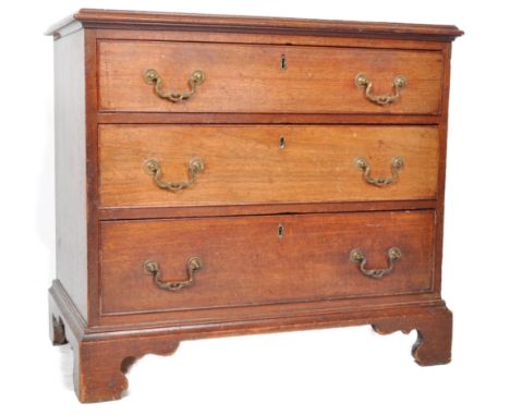A 19th Century George III small mahogany chest of drawers. The slightly graduating bank of three drawers having ornate brass 