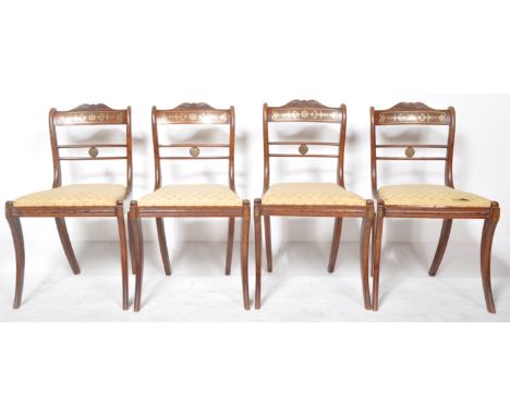 A set of four early 19th Century Regency period rosewood brass inlaid dining chairs / side chairs. Each with bar back and ins