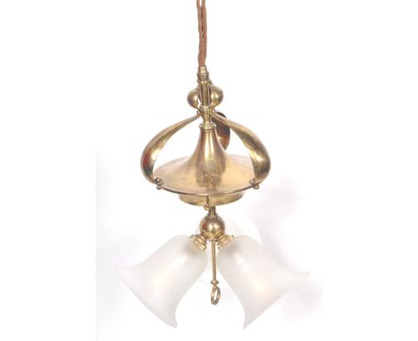 A 19th Century Victorian brass rise and fall ceiling light having a pulley system with ceramic wheels and brass fixture with 