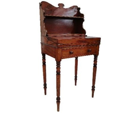 A 19th Century mahogany&nbsp;Bonheur de jour writing table desk comprising of a shaped waterfall shelf gallery back with fold