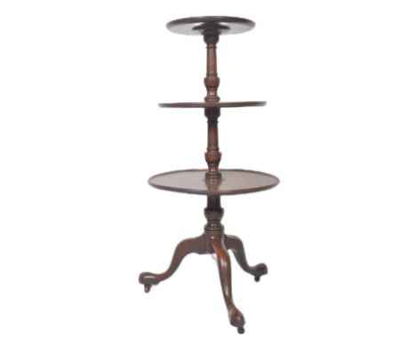 A 19th Century Victorian mahogany three tier dumbwaiter of circular form having three graduating tiers and central turned col