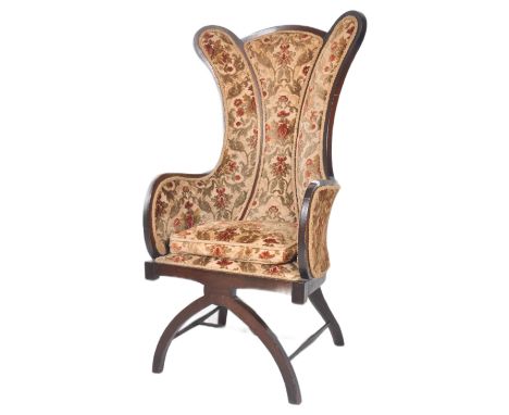 A 19th Century Victorian mahogany framed chair of unusual tall slender form having curved panel backrest with tapestry uphols