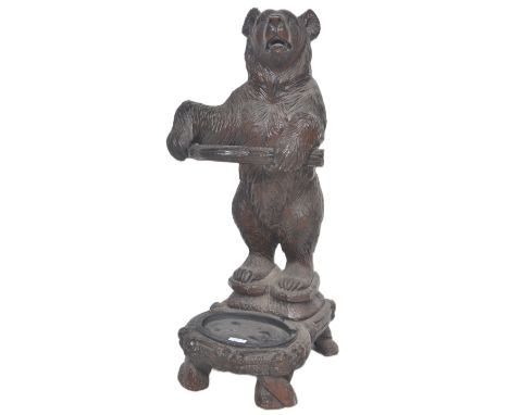 A 20th Century composite resin German Black Forest style faux carved wood umbrella stand / stick stand in the form of a bear.