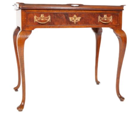 A 19th Century Dutch burr walnut tea table having a raised gallery top with single drawer below fitted with decorative brass 