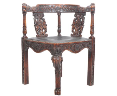 A 19th century Victorian carved oak corner chair. The chair with carved scroll legs and pad seat having carved back rail, pie