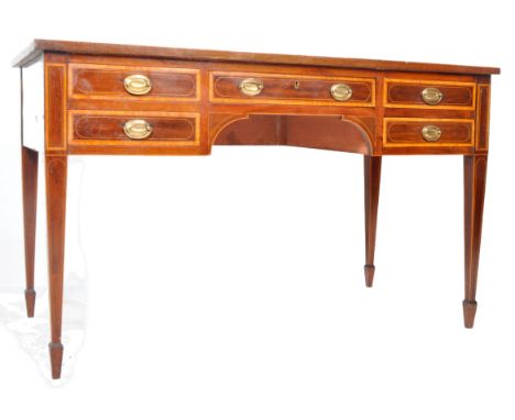 An early 19th Century George III Sheraton manner mahogany writing table desk. Series of drawers with satinwood inlay and bras