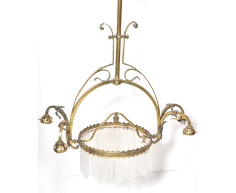 A 19th Century Victorian Gothic brass worked hanging chandelier / ceiling light having a central support and brass band with 