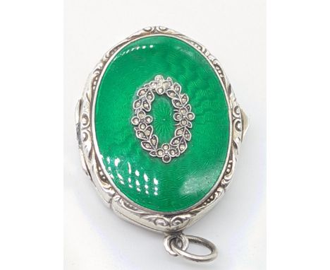 An early 20th century silver and green guilloche enamel pill box, London import hallmarks, maker C&amp;C (probably Cohen &amp