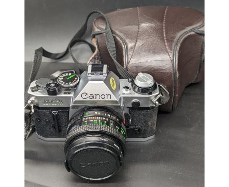 A Canon AE-1 camera, 50mm lens