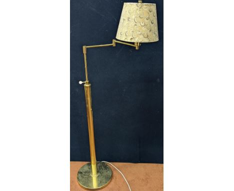 A floor standing reading lamp, adjustable height and shade angle