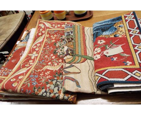 A group of four tapestry wall hangings having animal and floral decoration